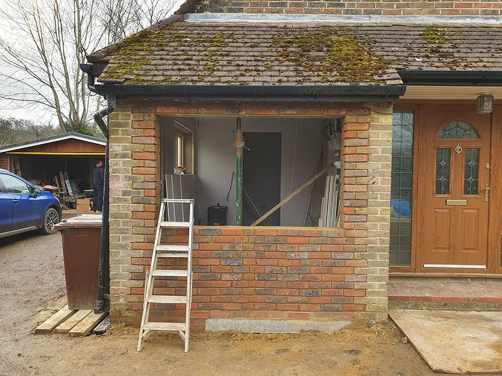 Brick infill, matched by hand